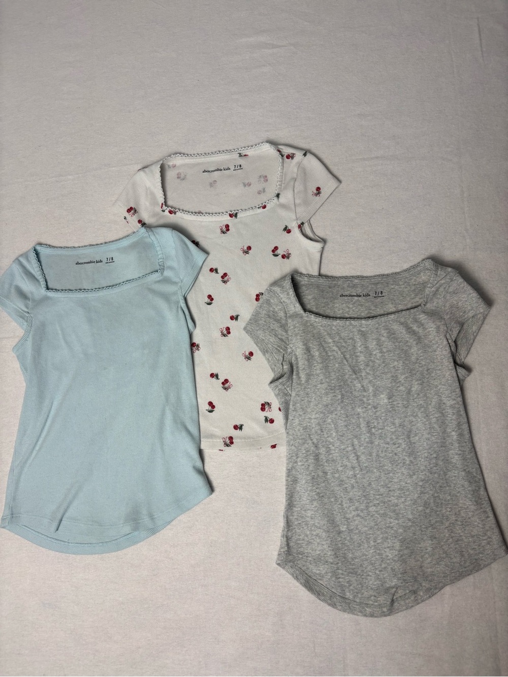 abercrombie kids Light Blue, White with Cherry Print, and Gray Tee Set of 3